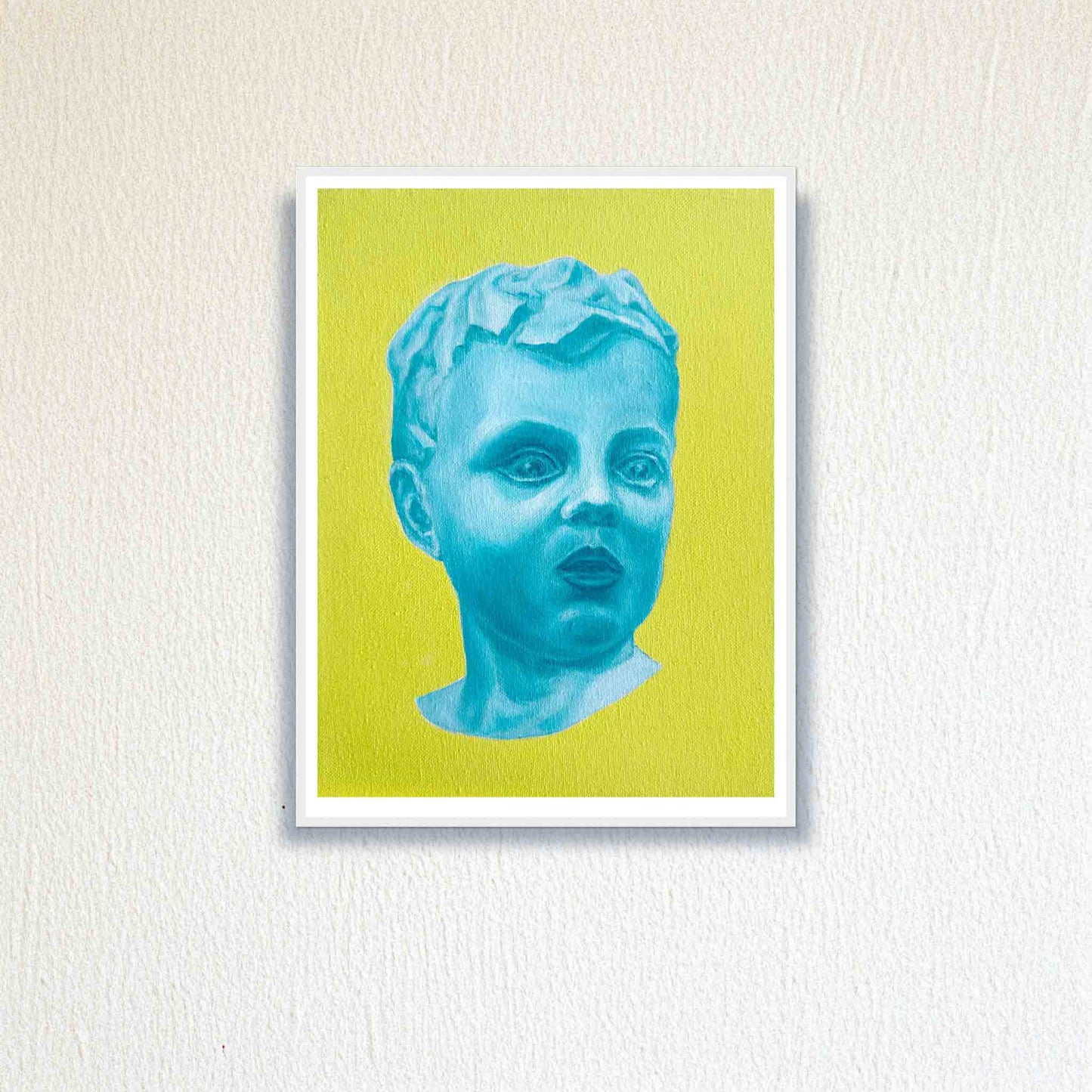 Framed artwork of a blue bust on a yellow background