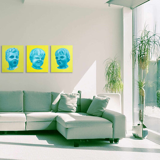 Modern living room with a white sectional sofa, green cushions, and three yellow artworks on the wall.