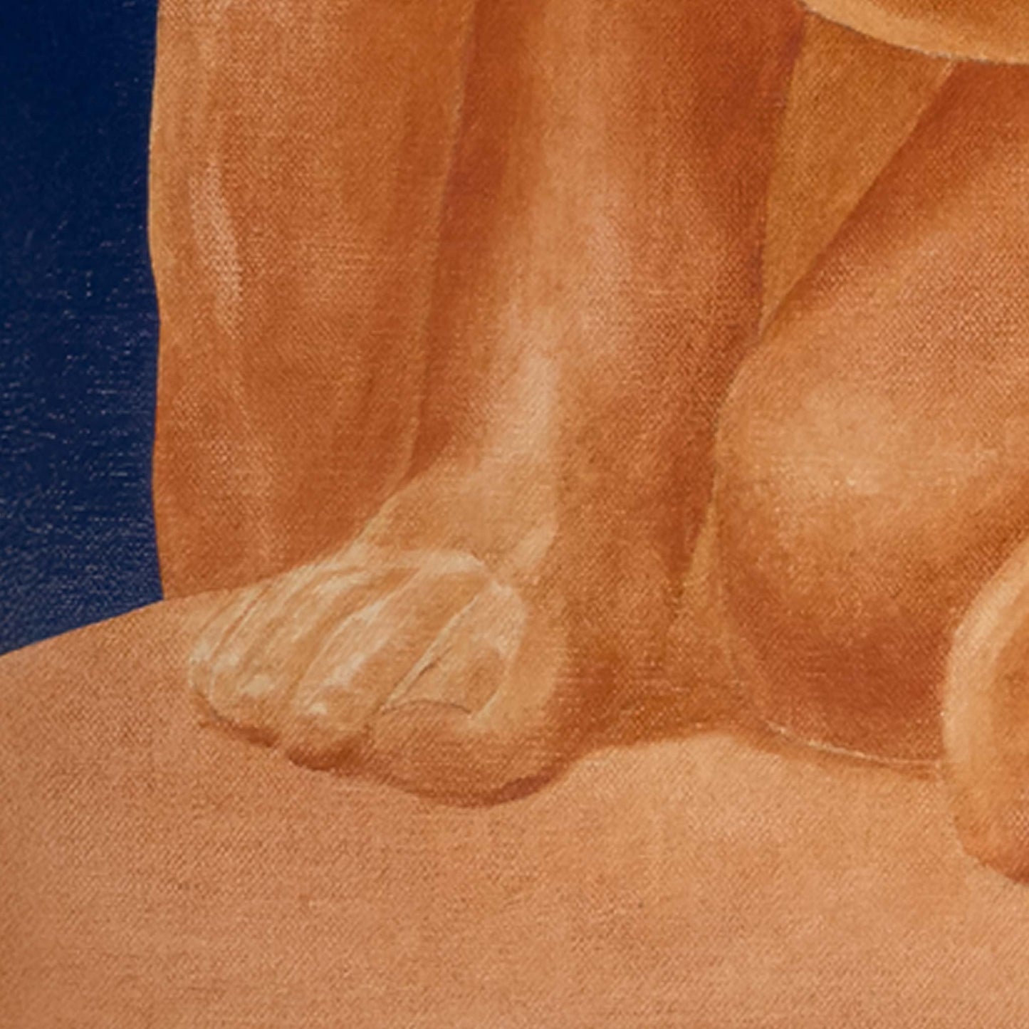 Close-up of a person's leg and foot with a blue background