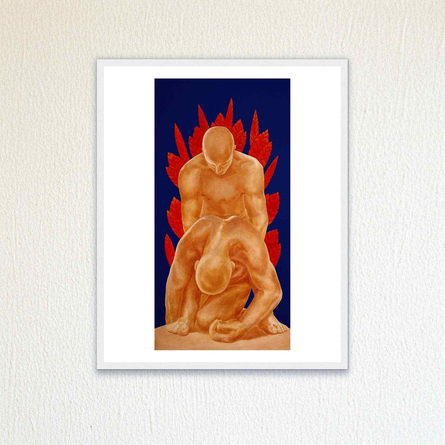 Framed artwork of two figures with red elements on a blue background, mounted on a textured white wall.